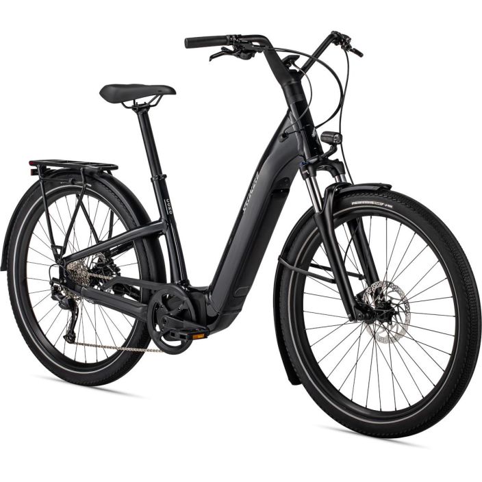 Specialized Como 3.0 ST Black Taysin varusteltu naisten sahkopyora. Valot edessa ja takana, lokasuojat, seisontajalka,