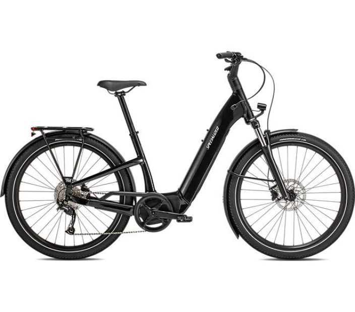 Specialized Como 3.0 ST Black Taysin varusteltu naisten sahkopyora. Valot edessa ja takana, lokasuojat, seisontajalka,